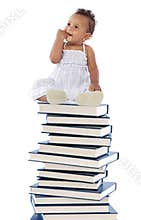 Baby on a book tower