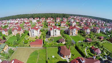 Panorama of cottage village near forest at sunny