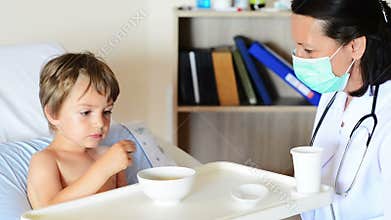 Doctor and little boy at clinic