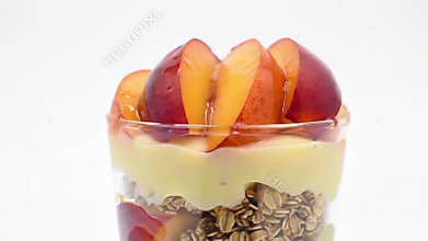 Delicious Nectarine Parfait Delight: A visually appealing close-up shot of a parfait, showcasing layers of granola, smooth cream,