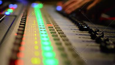 Audio Engineer Working on mixer equilizer