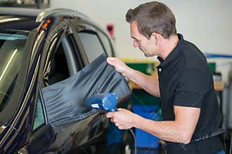 Car wrapper wrapping side mirror with vinyl film or foil