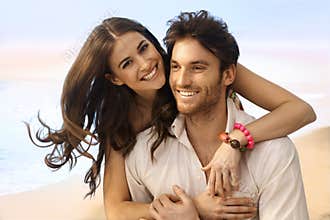 Portrait of happy married couple at the beach