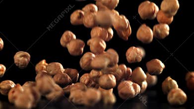 Chickpeas fall on the table. Filmed on a high-speed camera at 1000 fps.