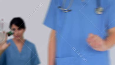 Nurse using digital touchscreen to look at various medical images