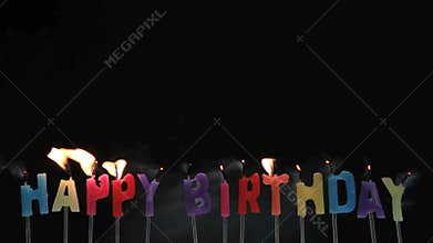 Happy birthday candles being extinguished