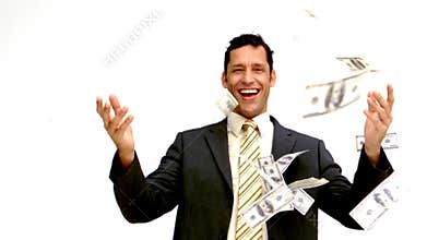 Businessman joyfully throwing his money