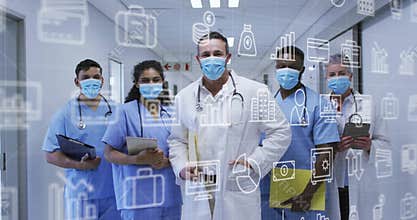 forward zooming revealing medical team in hospital corridor with transparent data icons shifting