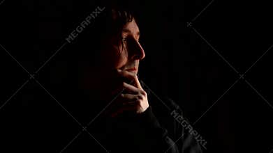 Sad man covering face with hands and crying in despair. Chronic depression, grief, sorrow, sadness, melancholy, moaning concept.