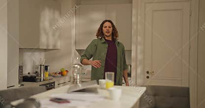 A person prepares breakfast in a bright kitchen, enjoying a peaceful morning with delicious food and soft sunlight