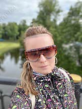 a woman poses in front of the city of Vitebsk