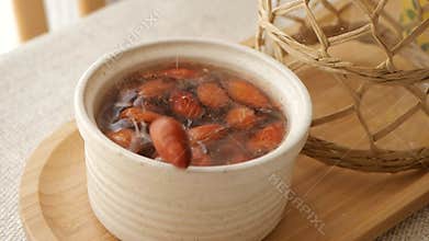 closeup of almond nuts in a bowl of water
