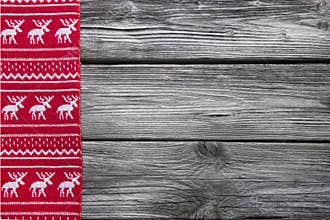 Wooden background with a red frame of reindeer for christmas dec
