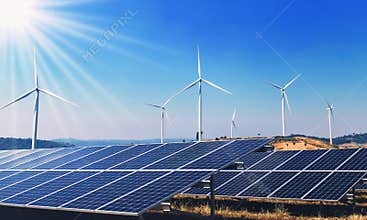 concept clean energy power in nature. solar panels and wind turbine