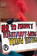 Small group of angry anti government anarchists stage a protest at Portland Place, London.