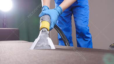 Professional dry cleaning of a sofa. The concept of cleaning in the office or at home