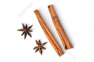 Two brown vegeterian cinnamon sticks lying on white background