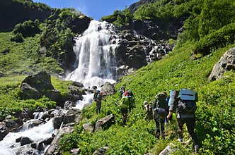 Caucasian biosphere reserve, Russia, August, 02, 2017. Tourists hiking to the upper Imeretinsky waterfall on the river Imeretinka