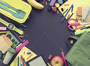 Concept back to school apple backpack stationery on black background.