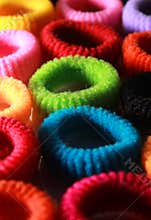 Colorful elastic hair bands with side lighting vertical frame.