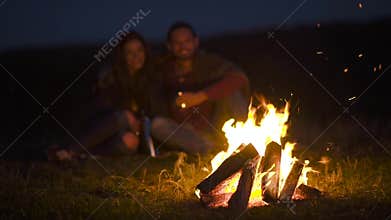 Romantic Weekend. Couple In Love Near Bonfire In Nature