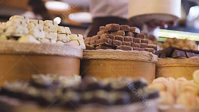 Chocolate store. Shelves with handmade sweets closeup
