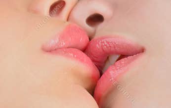 Lesbian Couple Together Concept. Kiss lesson. Two women friends kissing. Two beautiful lesbians in love. Sensual
