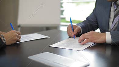 The heads of two large companies sign an agreement on mutual cooperation in slow motion