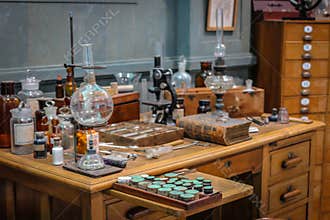 Old science lab with chemical reagents and burner