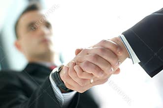 Business people shaking hands together