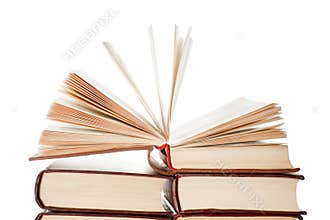 Open book on top of the books pile isolated
