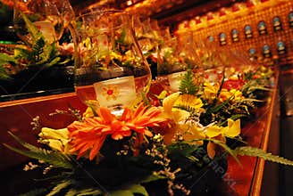 Glass candle holders at an altar bathed in amber interior lights