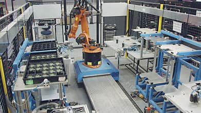 Robot working in an electronics manufacturing facility