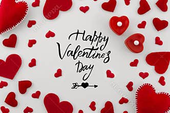 Romantic greeting card with hand written phrase happy valentines day in the center with different size red hearts on