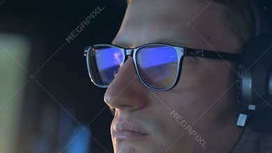 Close up of a computer game reflecting in gamer`s glasses