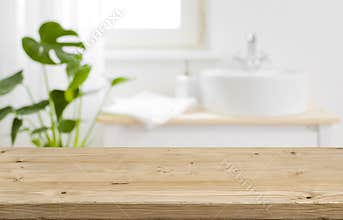 Empty tabletop for product display with blurred bathroom interior background