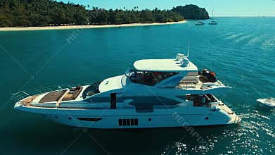 Aerial: Luxury boat near the beach.
