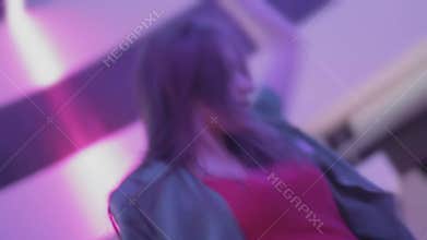 Excited woman crazy dancing to music, clubbing at night club