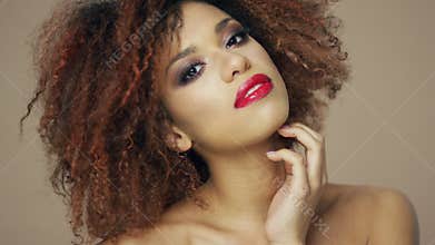 Charming ethnic model with curly hair