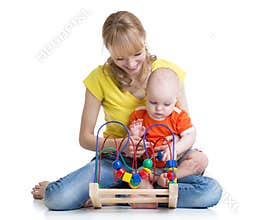 Child boy and mother play with color educational toy