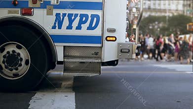 Close-up view of emergency service driving through the traffic road in the downtown full of cars. Accident in the city