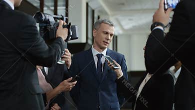 Politic man giving interview willingly