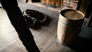 Rope and barrel with rum lying on floor of Maritime museum in Gdansk, attributes