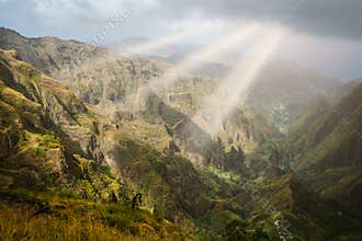 Sun rays coming through the clouds in rocky mountain landscape of in Xo-xo valley in Santo Antao island, Cape Verde
