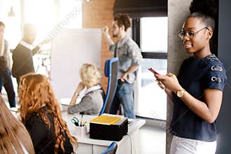Close up side view shot of Africanamerican secretary surfing the Net