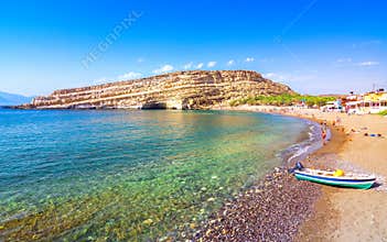 Matala beach with caves on the rocks, Crete, Greece.