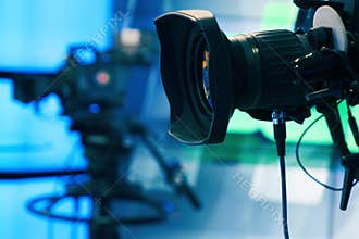 Broadcast television studio camera and crane camera in news studio room
