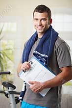 Personal trainer with training plan.