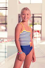 Nice young girl wearing a stylish swimsuit