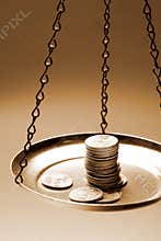 Money on a balance scale
